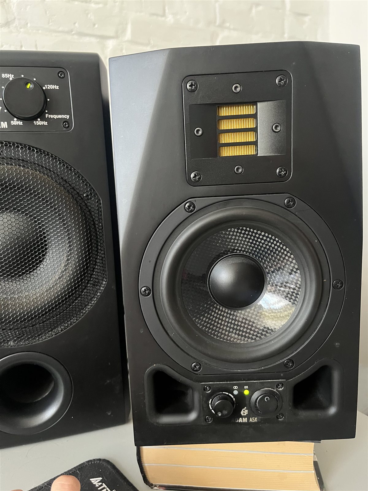 Pair of ADAM A5X active nearfield monitors in a home studio.