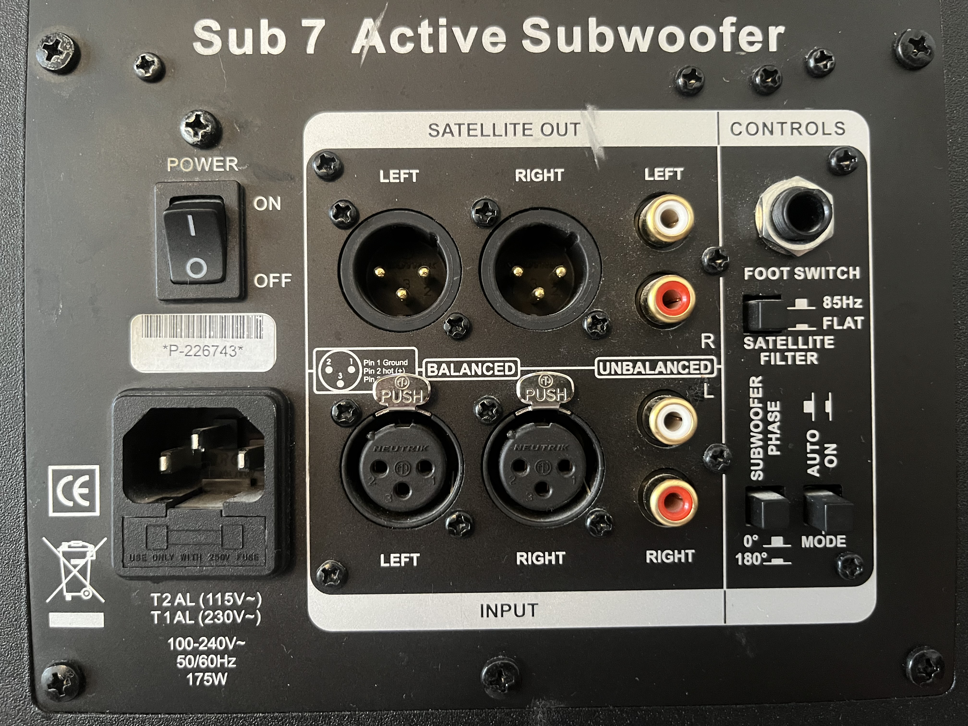 Rear connection panel of an ADAM Sub7 subwoofer, showing balanced XLR inputs and satellite outputs, RCA connections, phase, and filter controls.