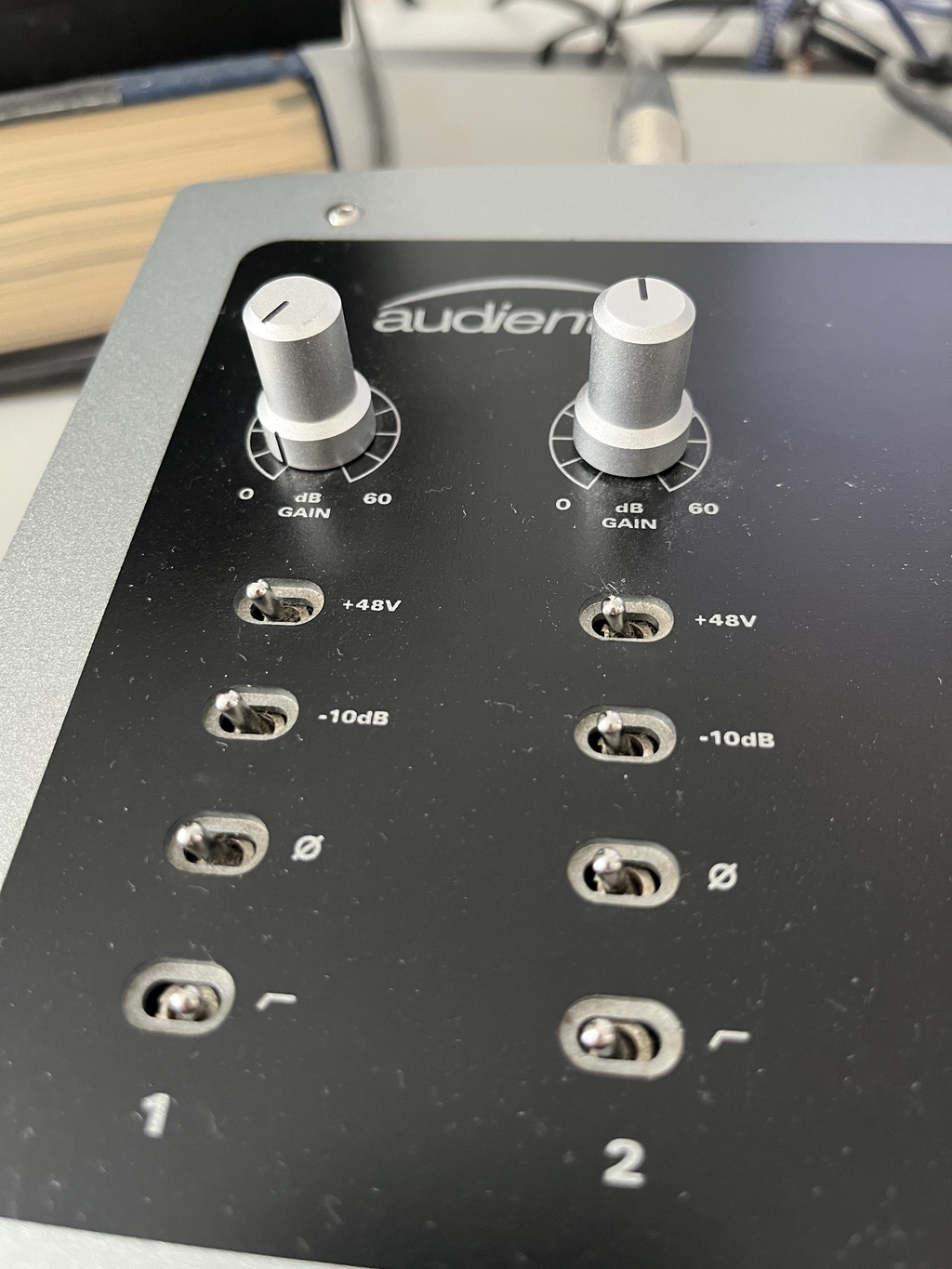Input gain controls and phantom-power switches on an Audient iD22 audio interface