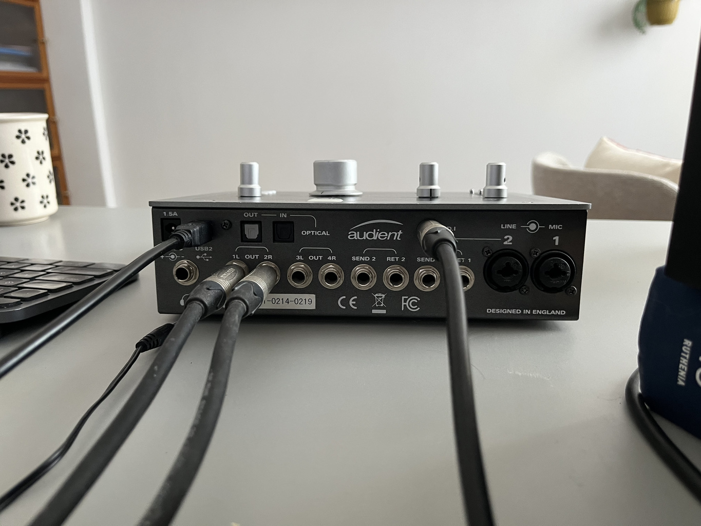 Rear connections of an Audient iD22 audio interface in a home studio