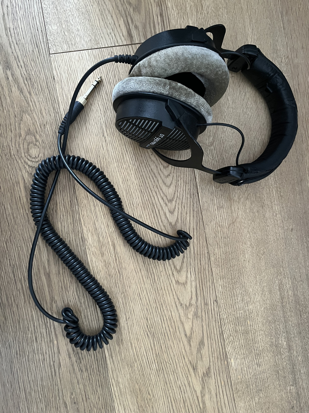 Beyerdynamic DT 990 Pro 250 Ohm with its coiled cable and quarter-inch plug