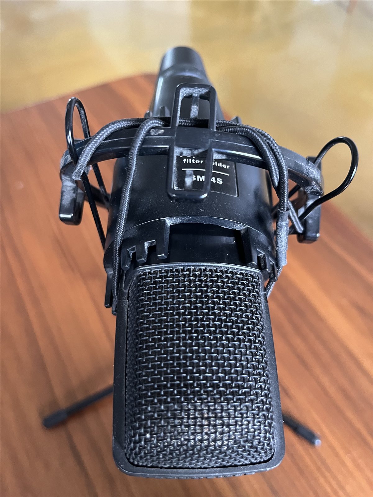 Overhead view of a studio microphone in a shock mount.